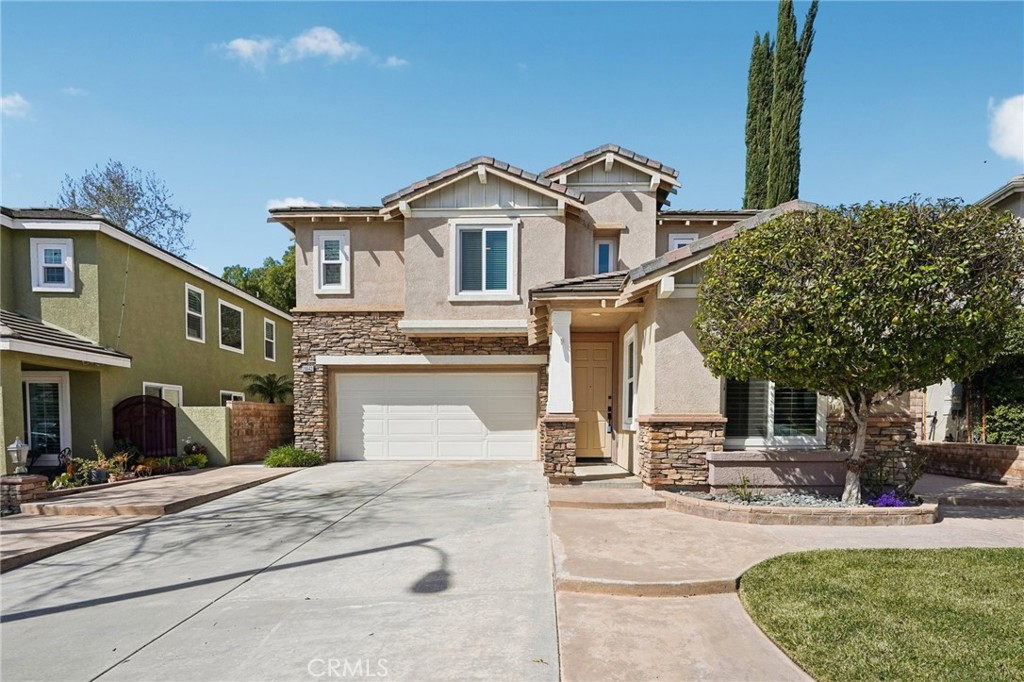 28643 Silverking Trail Saugus, CA 91390 - Photo 1 of 1 a view of a white house with a small yard and a large tree