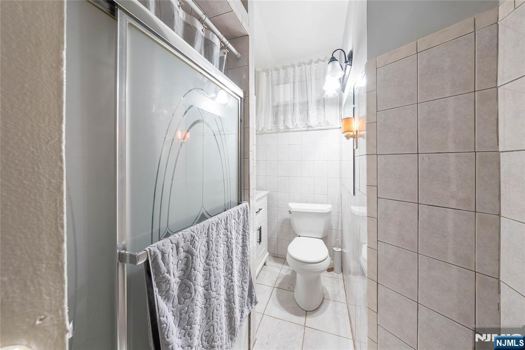 58 Park Paterson, NJ 07501 - Photo 11 of 36 a bathroom with a sink and mirror