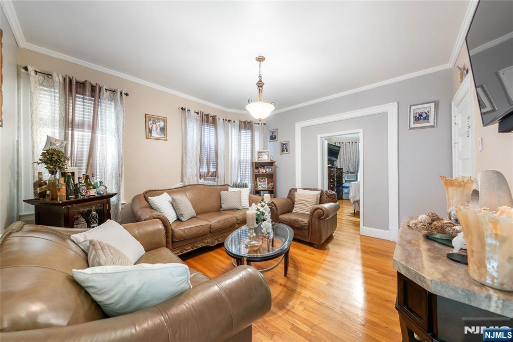 58 Park Paterson, NJ 07501 - Photo 18 of 36 a living room with furniture or couch and a chandelier