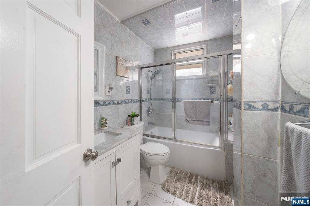 58 Park Paterson, NJ 07501 - Photo 20 of 36 a bathroom with a shower toilet and sink