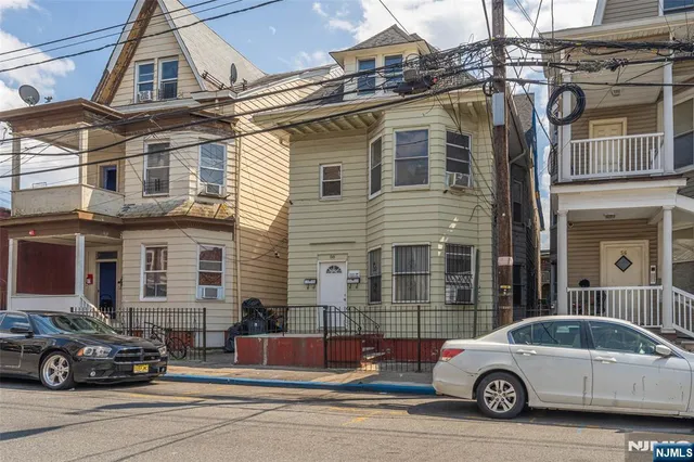 a car parked in front of a house