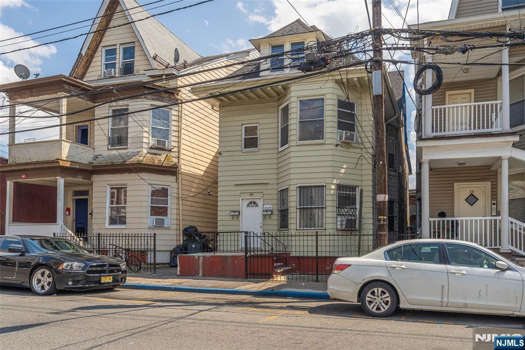 58 Park Paterson, NJ 07501 - Photo 2 of 36 a car parked in front of a house