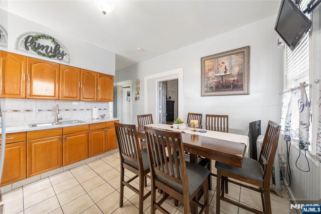 58 Park Paterson, NJ 07501 - Photo 22 of 36 a view of a dining room with furniture and a kitchen