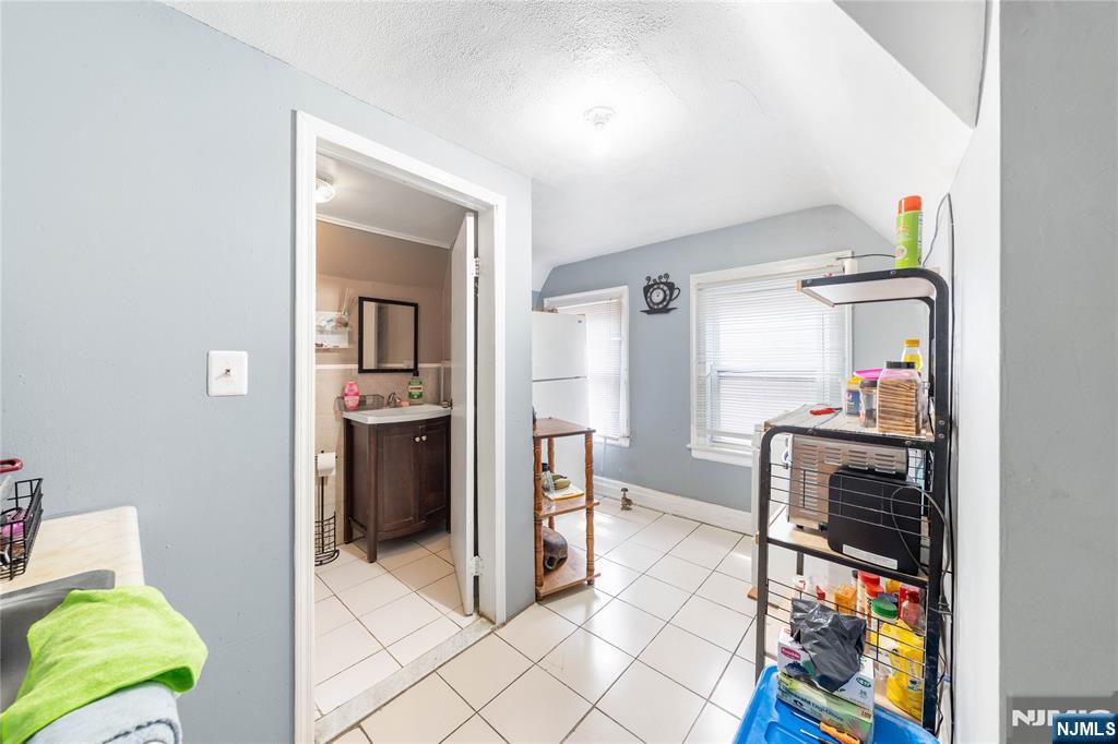 58 Park Paterson, NJ 07501 - Photo 27 of 36 a view of kitchen with furniture and refrigerator