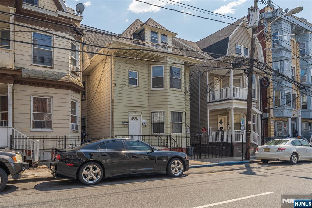 58 Park Paterson, NJ 07501 - Photo 3 of 36 a car parked in front of a house