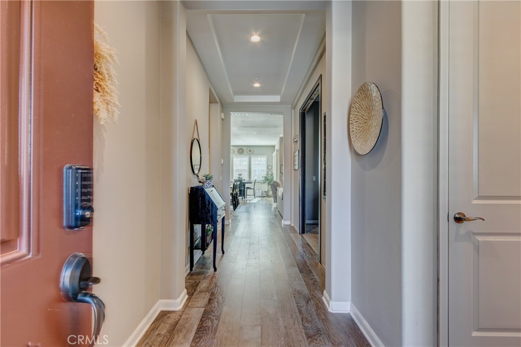 11137 Briar Rose Court Corona, CA 92883 - Photo 9 of 75 a view of a hallway with wooden floor and entryway