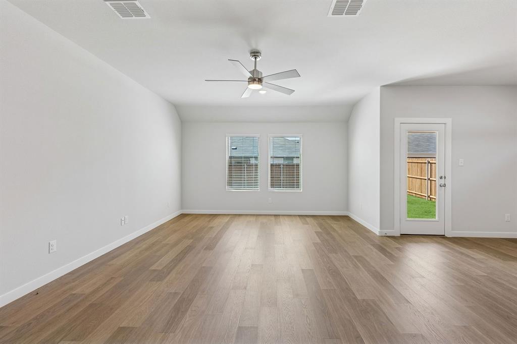 769 Sierra Ridge Lavon, TX 75166 - Photo 10 of 37 Living Room in the Harrison home plan by Trophy Signature Homes – REPRESENTATIVE PHOTO