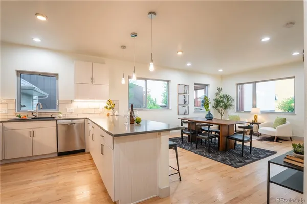 a kitchen with lots of counter top space and dining table