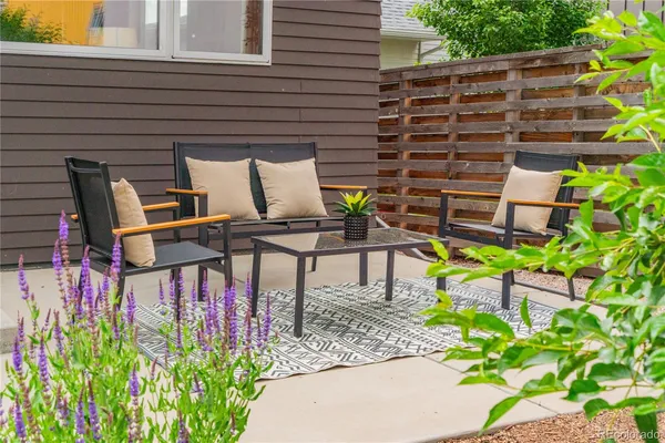 a view of a chairs and table in the patio