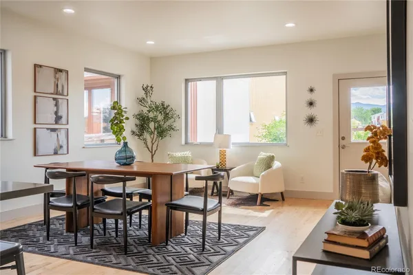 a view of a dining room with furniture window and wooden floor