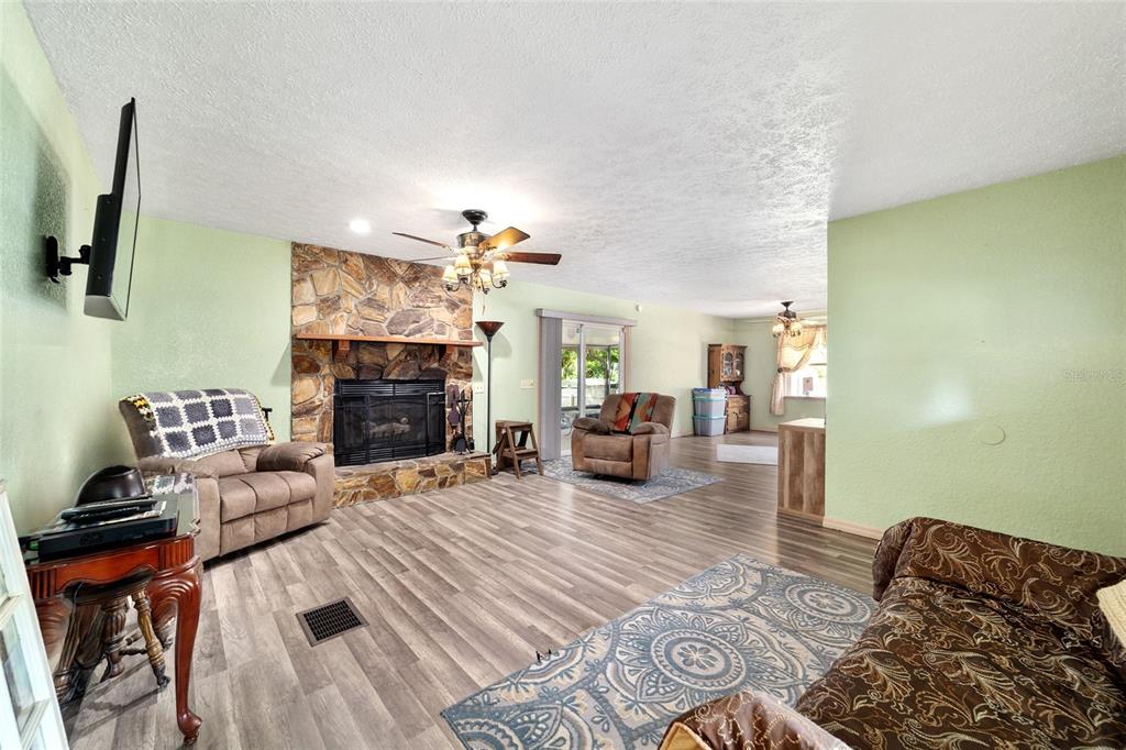 15755 Southwest 90th Avenue Dunnellon, FL 34432 - Photo 10 of 55 a living room with furniture and a fireplace