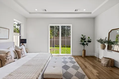 a bathroom with a granite countertop sink a toilet and shower