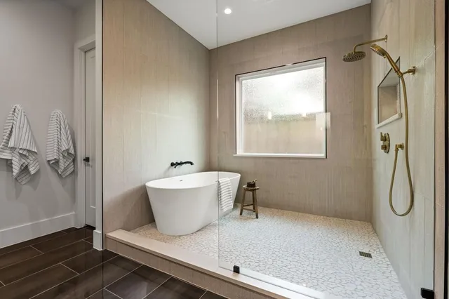 a bathroom with double vanity sinks and a mirror
