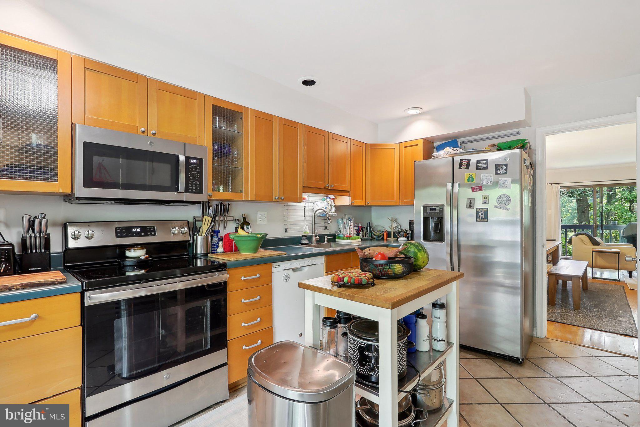 2031 Approach Lane Reston, VA 20191 - Photo 19 of 58 Modern kitchen with warm wood tones.
