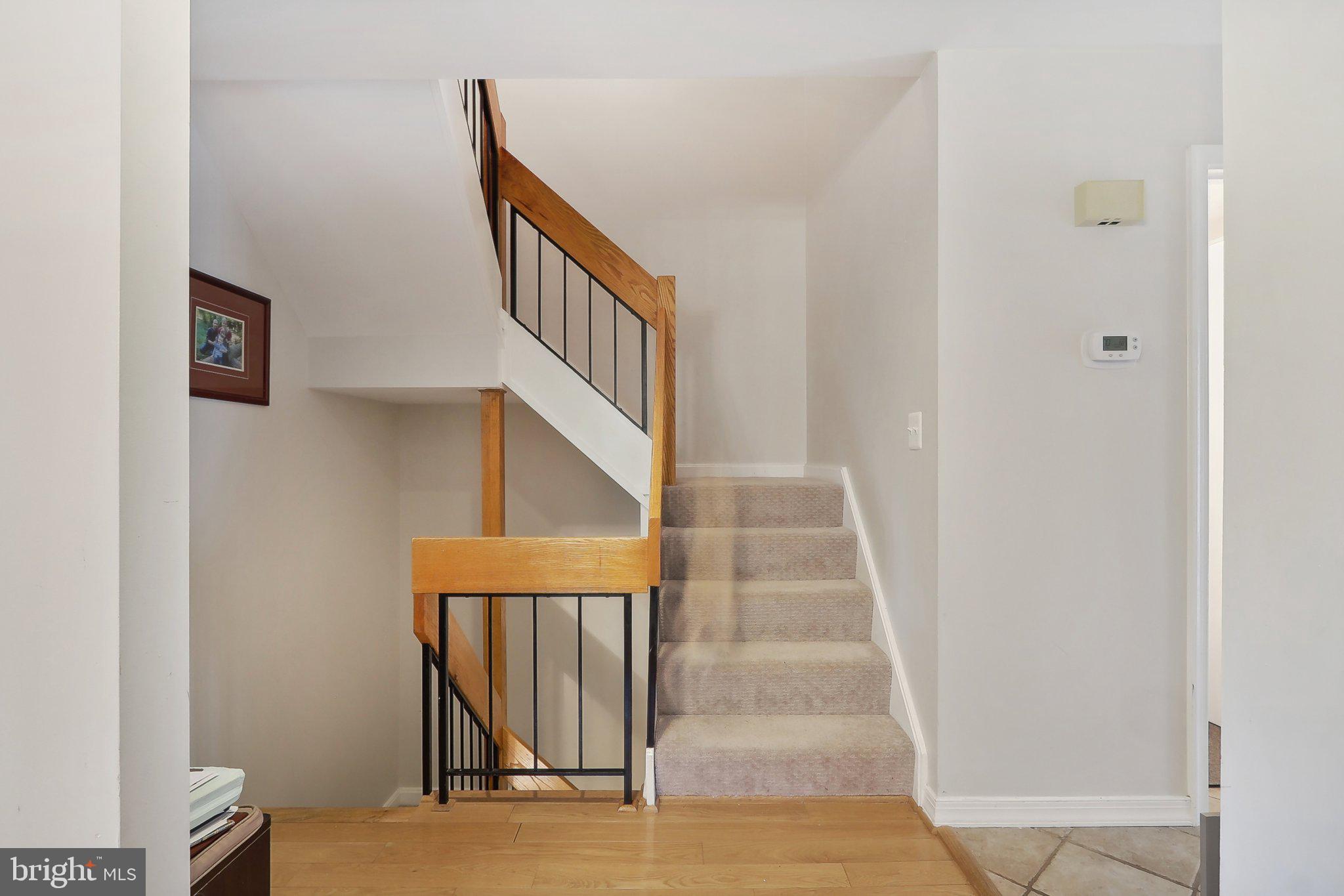 2031 Approach Lane Reston, VA 20191 - Photo 29 of 58 Inviting entryway with staircase charm.