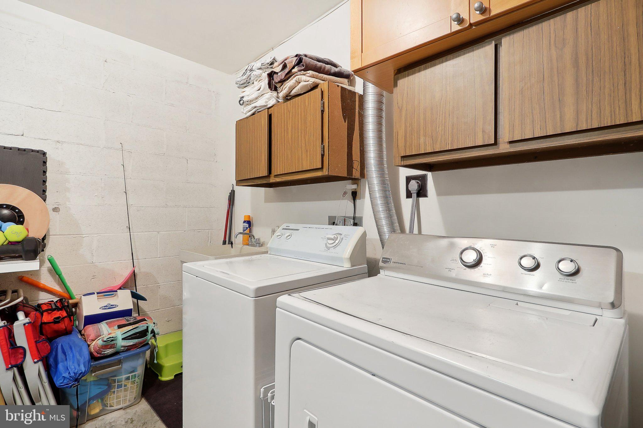 2031 Approach Lane Reston, VA 20191 - Photo 34 of 58 Functional laundry space with storage.