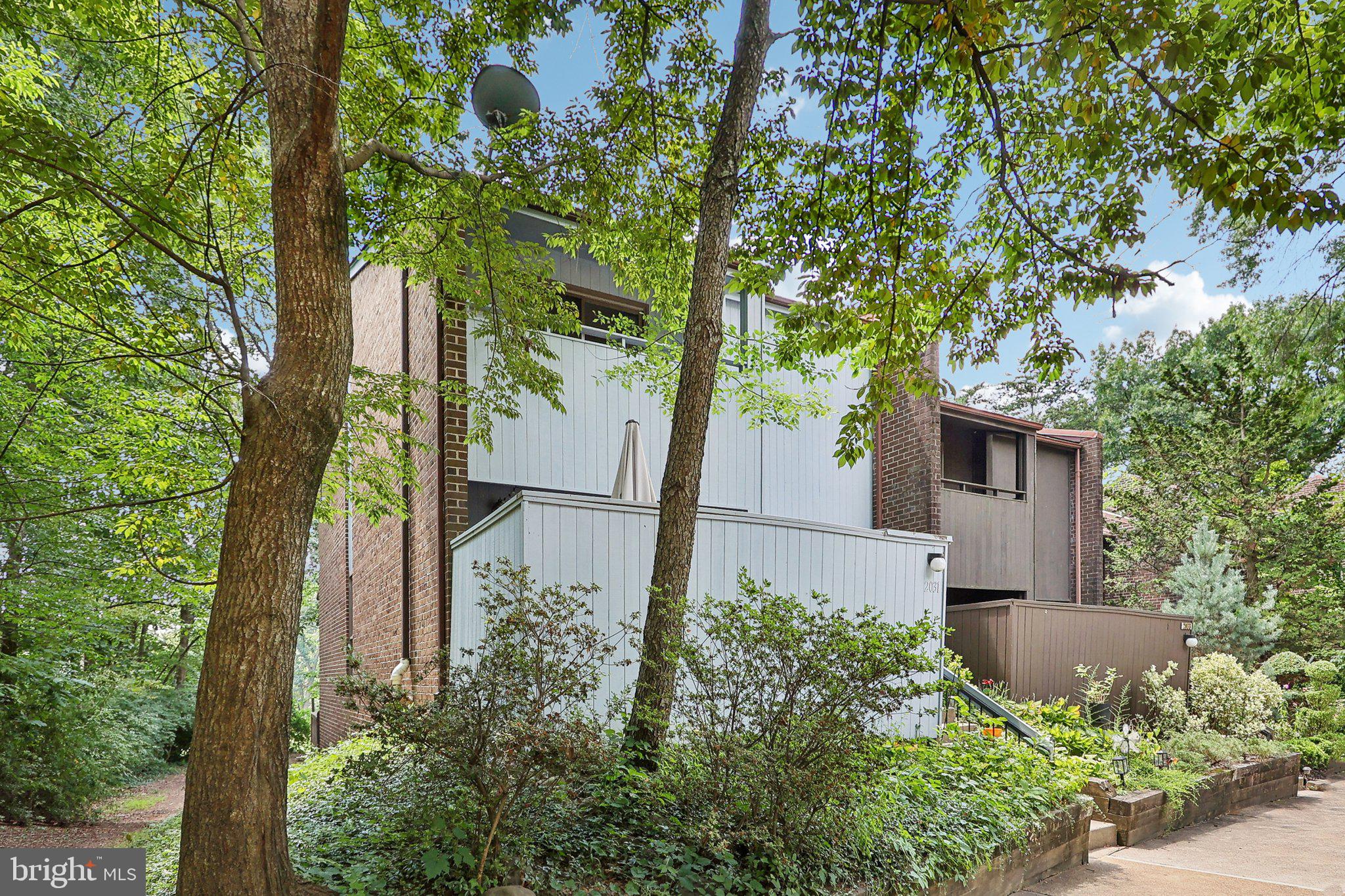 2031 Approach Lane Reston, VA 20191 - Photo 4 of 58 Serene home nestled in lush greenery.