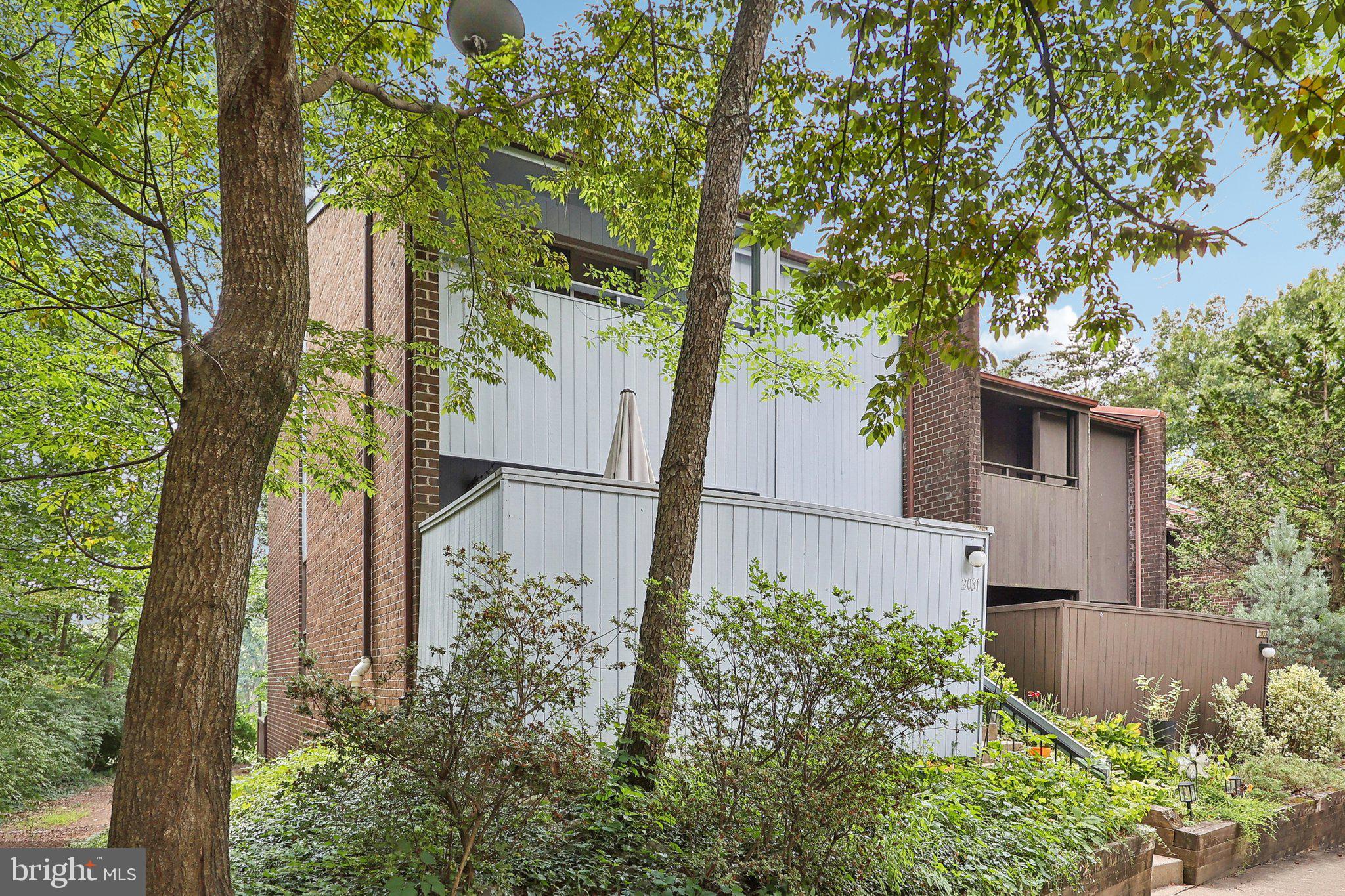 2031 Approach Lane Reston, VA 20191 - Photo 5 of 58 Charming home nestled in lush greenery.