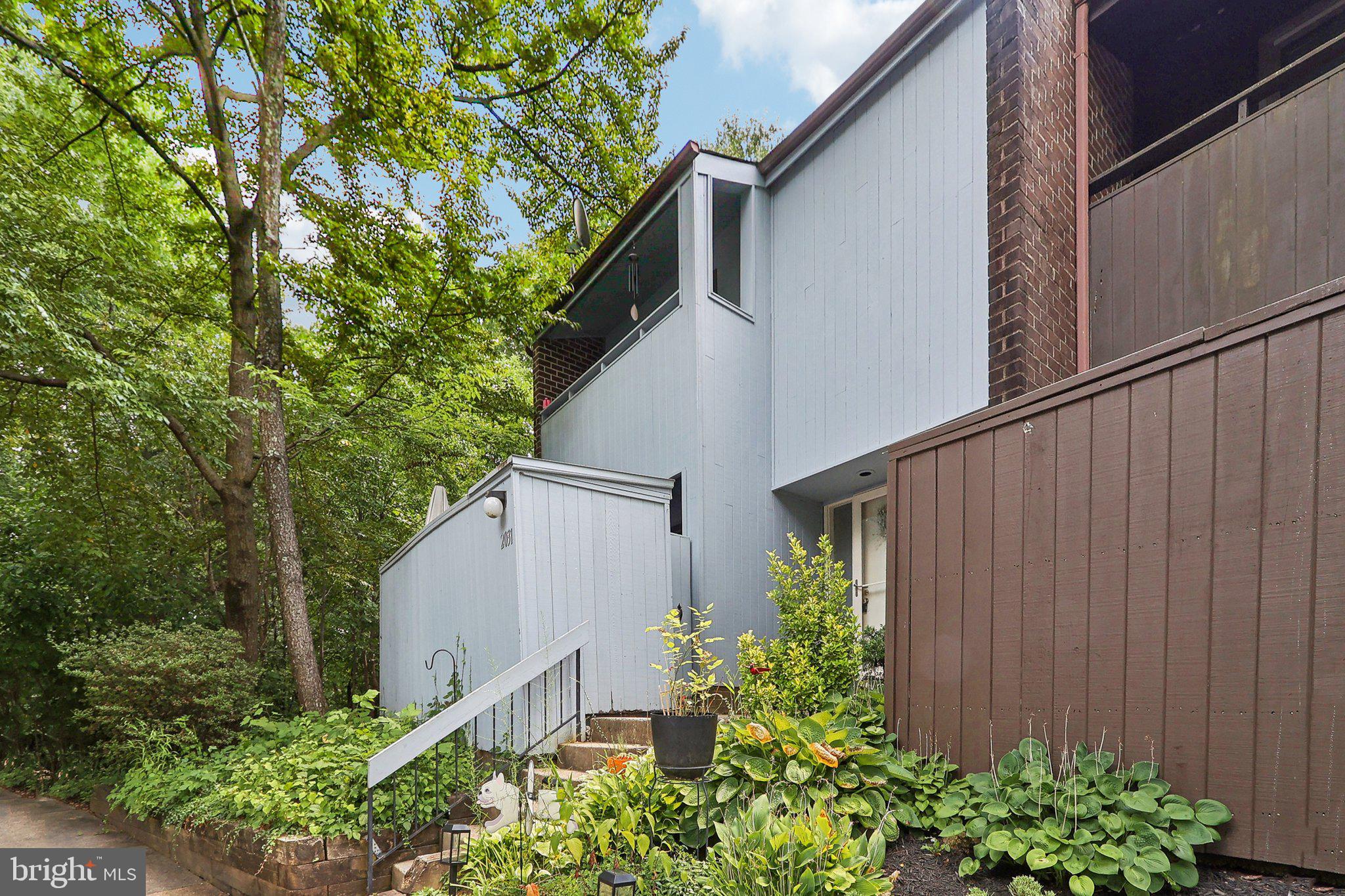 2031 Approach Lane Reston, VA 20191 - Photo 6 of 58 Charming home nestled in lush greenery.