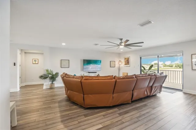 a large kitchen with a table and chairs