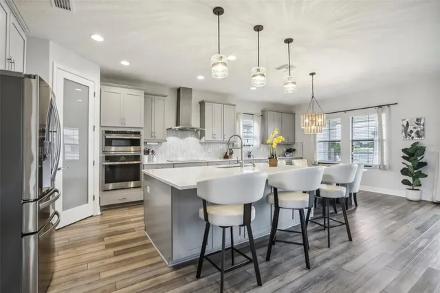 a view of entryway and hall with wooden floor