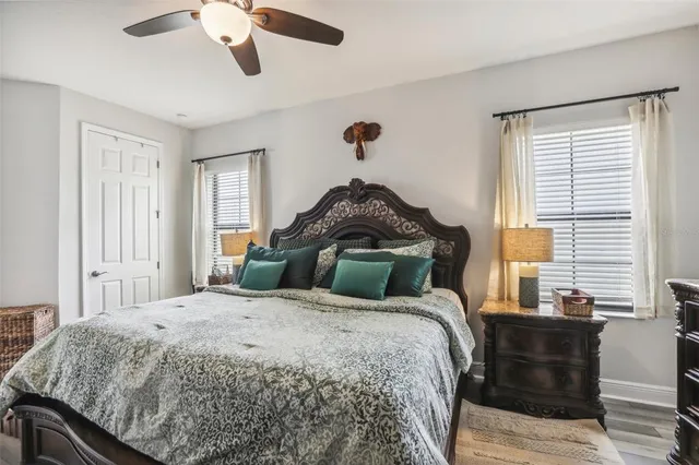 a spacious bathroom with a double vanity sink a mirror and a bathtub