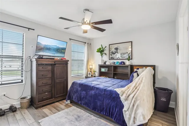 a bathroom with a sink shower and a mirror
