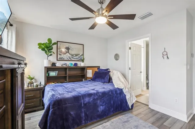 a bedroom with a bed and a closet