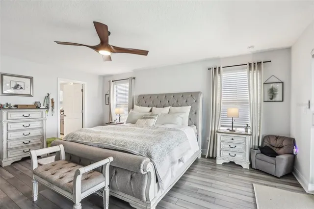 a living room with furniture and ceiling fan