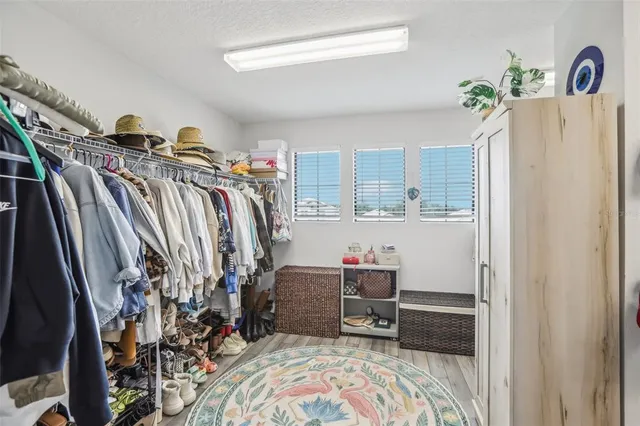 a view of a house with backyard and a garden