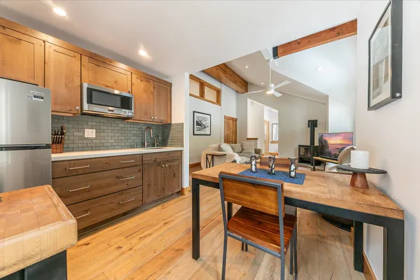 a view of an entryway with wooden floor and stairs