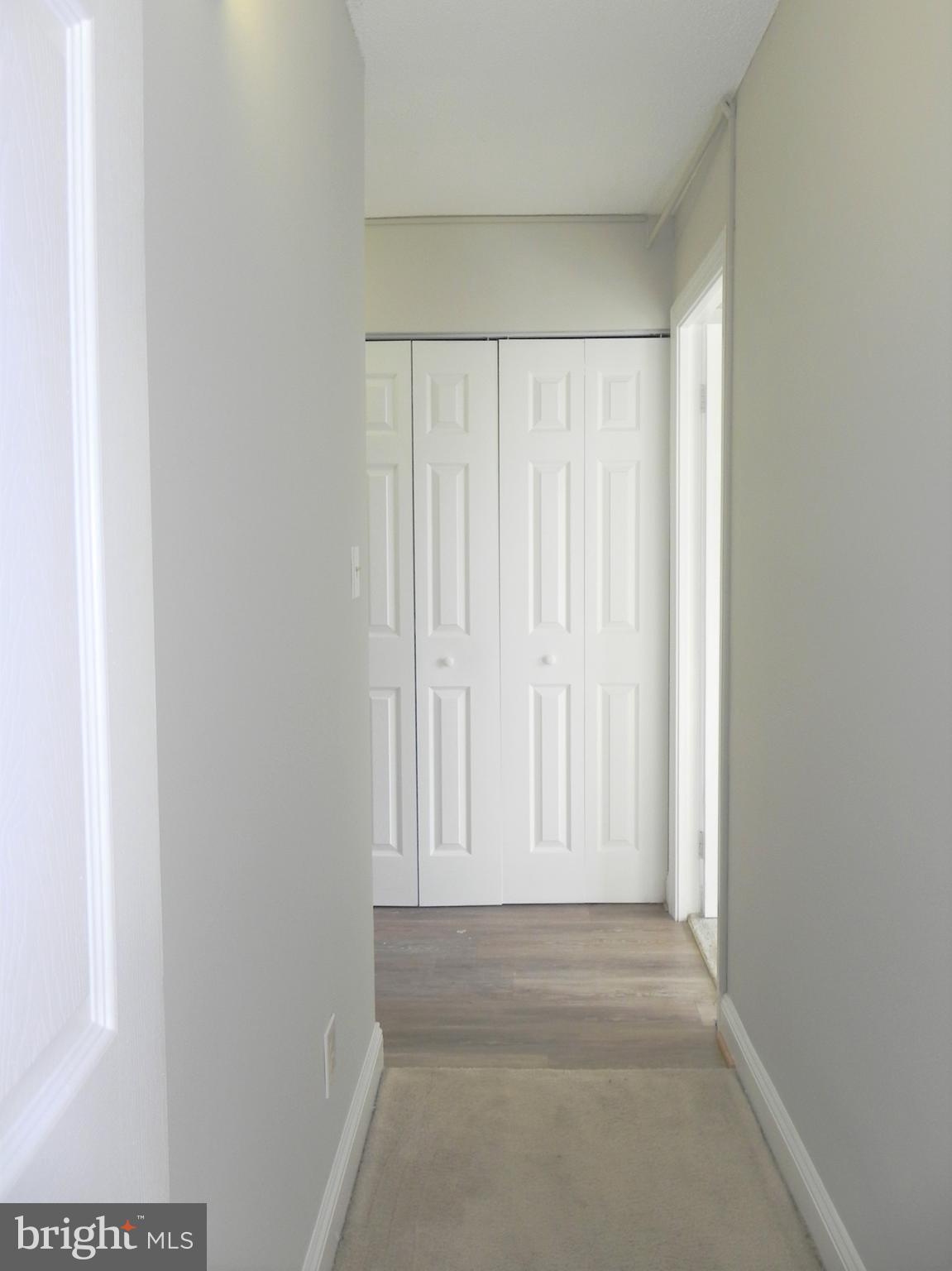 1301 South Arlington Ridge Road, Unit 408 Arlington, VA 22202 - Photo 26 of 46 Hallway from Primary Bedroom