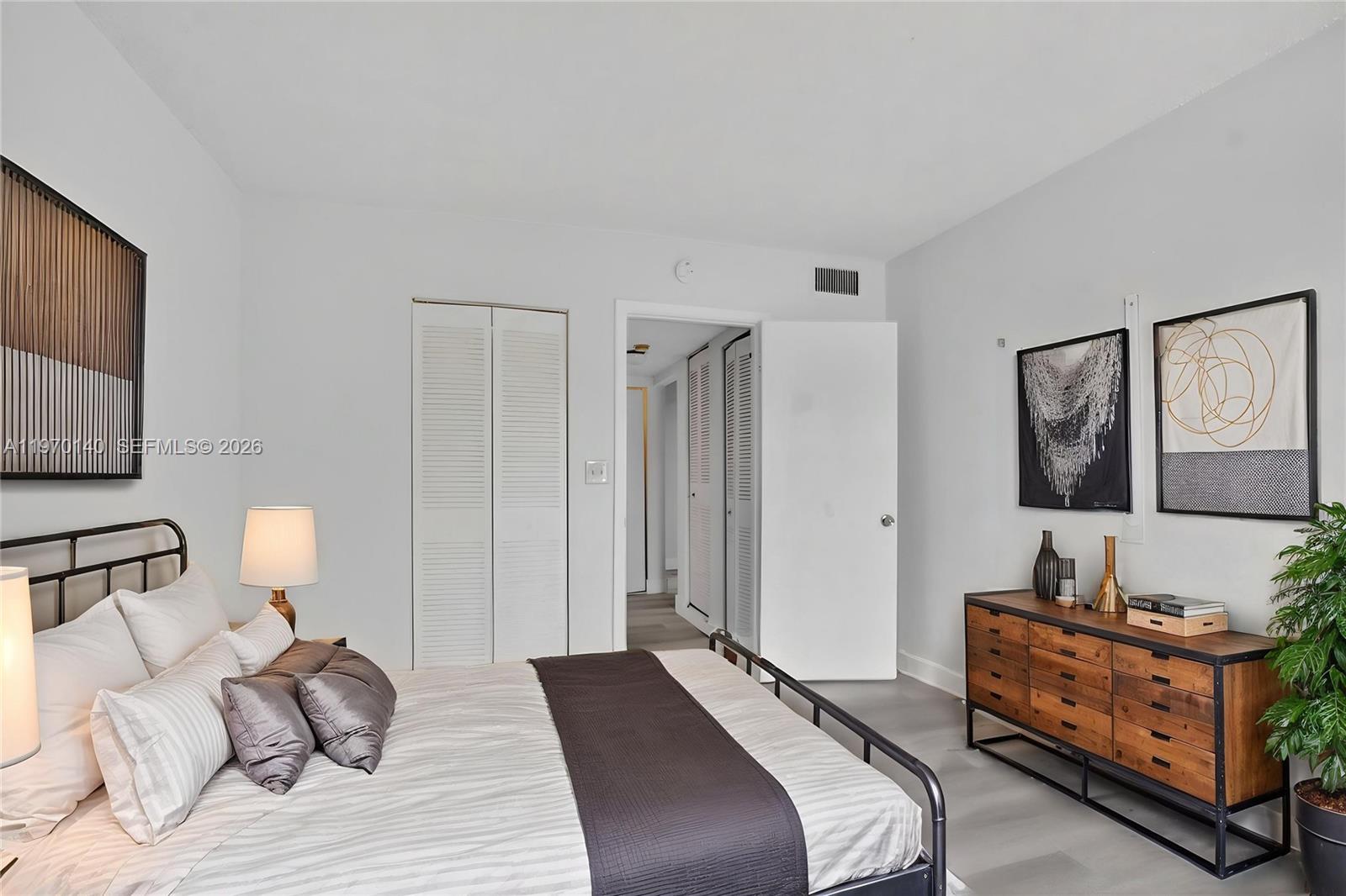 450 Northwest 20th Street, Unit 2120 Boca Raton, FL 33431 - Photo 8 of 27 a bedroom with a bed and a couch