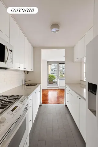 a large kitchen with a stove top oven