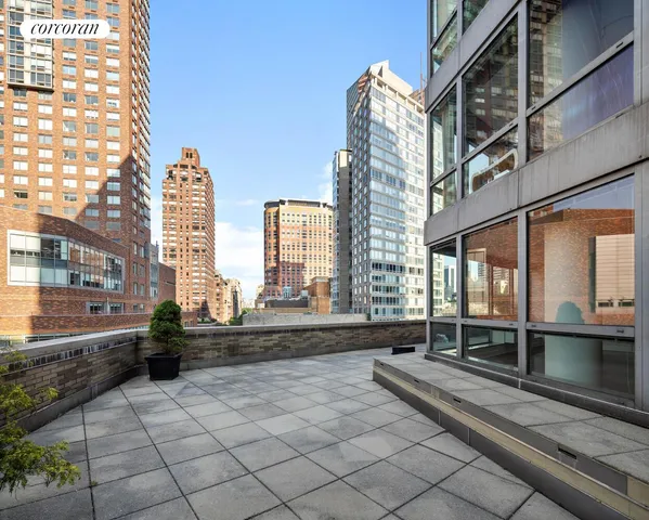 a large building with a bench in front of it