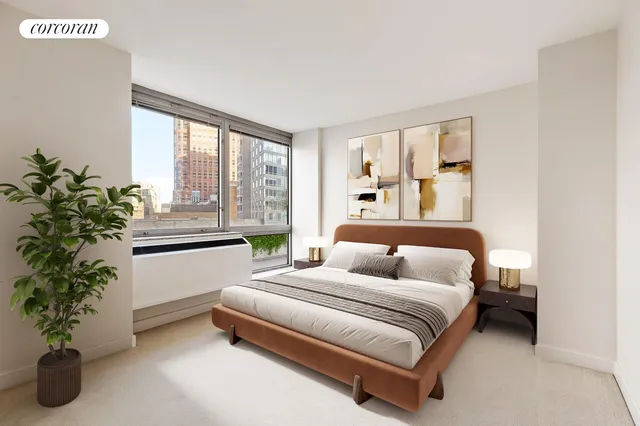 a bedroom with bed and a potted plant