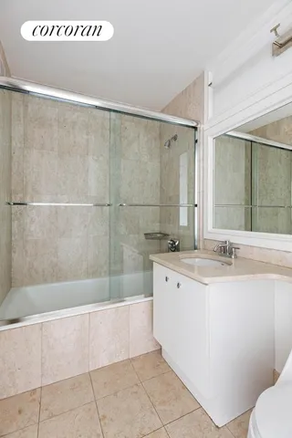 a bathroom with a bathtub and a sink