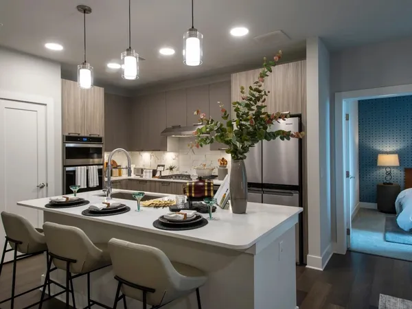 a kitchen with a table and chairs in it