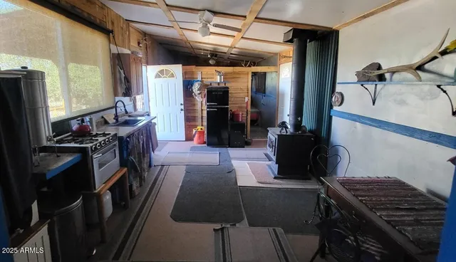 a kitchen with a table and chairs