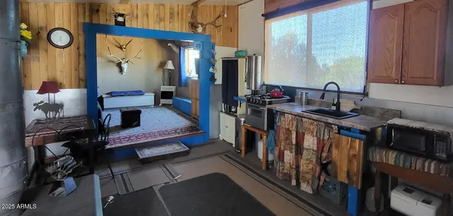 a bedroom with furniture and a window