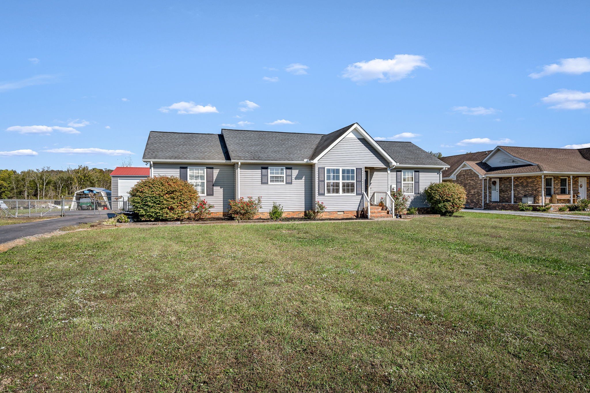 2936 Midland Road Shelbyville, TN 37160 - Photo 2 of 46 a front view of a house with a garden