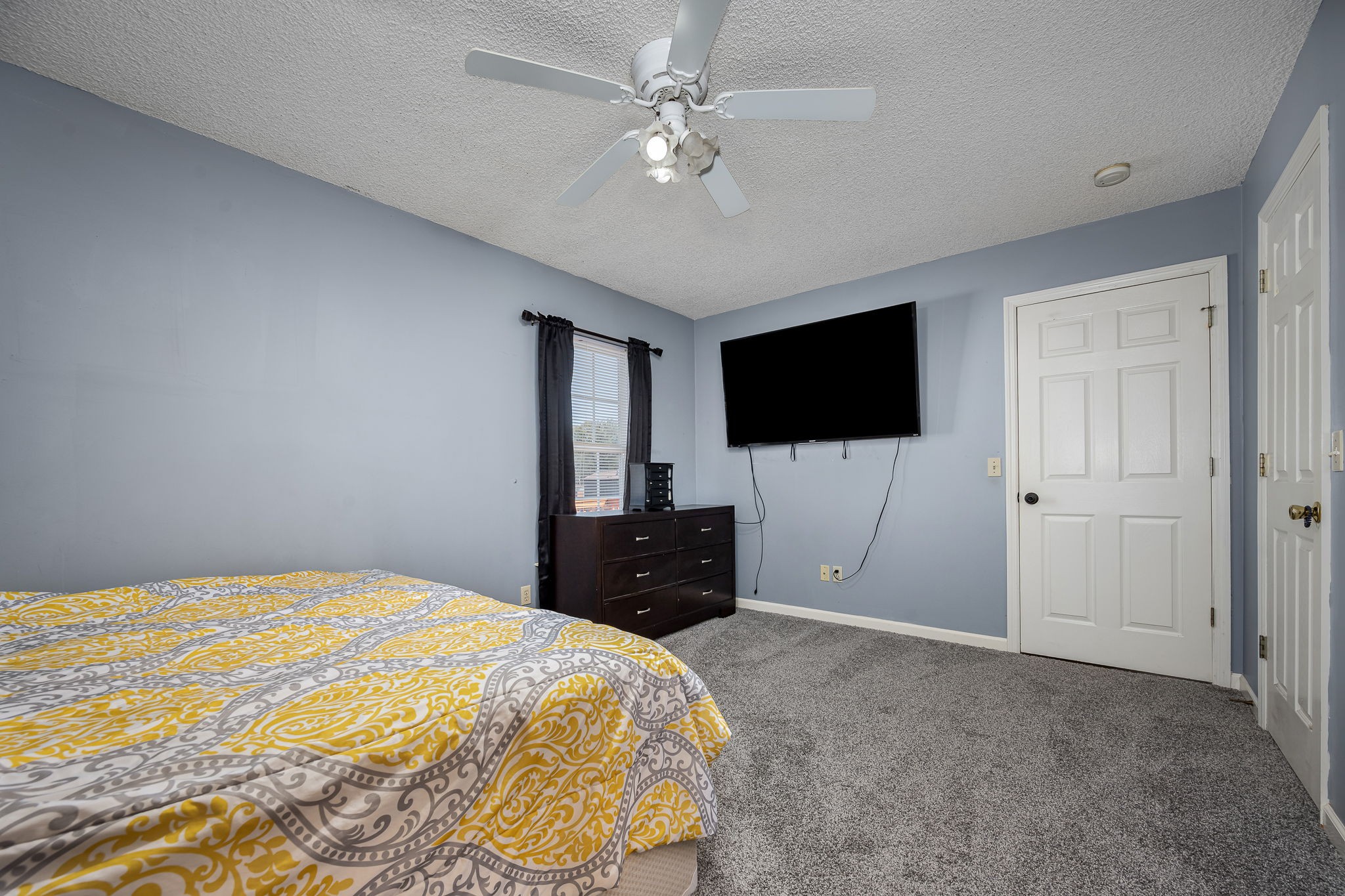 2936 Midland Road Shelbyville, TN 37160 - Photo 25 of 46 a bedroom with a bed and a flat screen tv