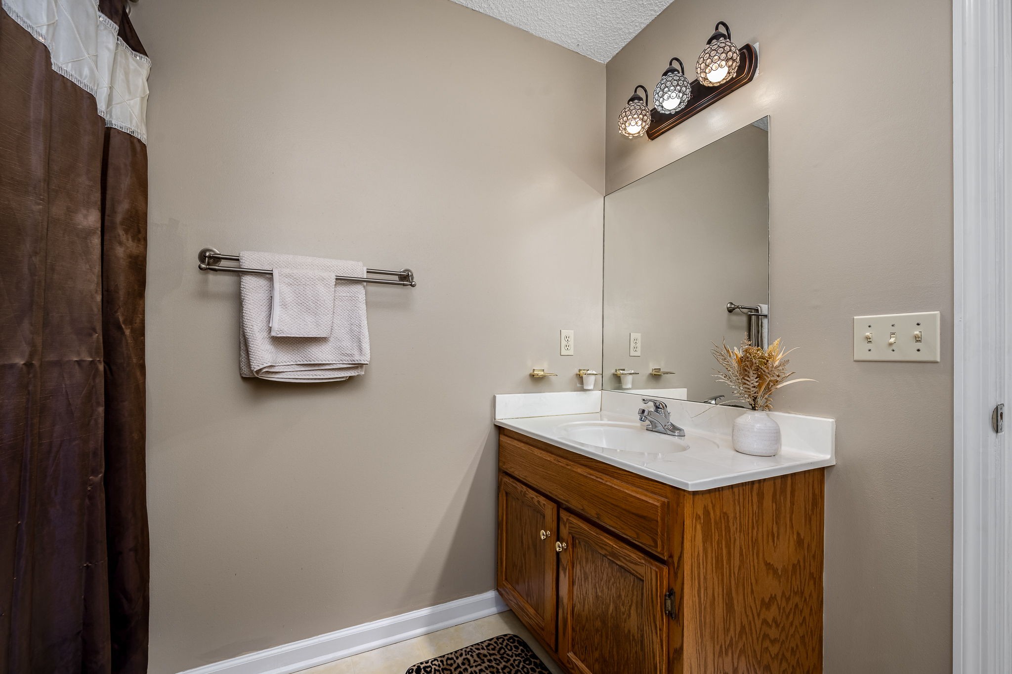2936 Midland Road Shelbyville, TN 37160 - Photo 27 of 46 a bathroom with a sink and a mirror