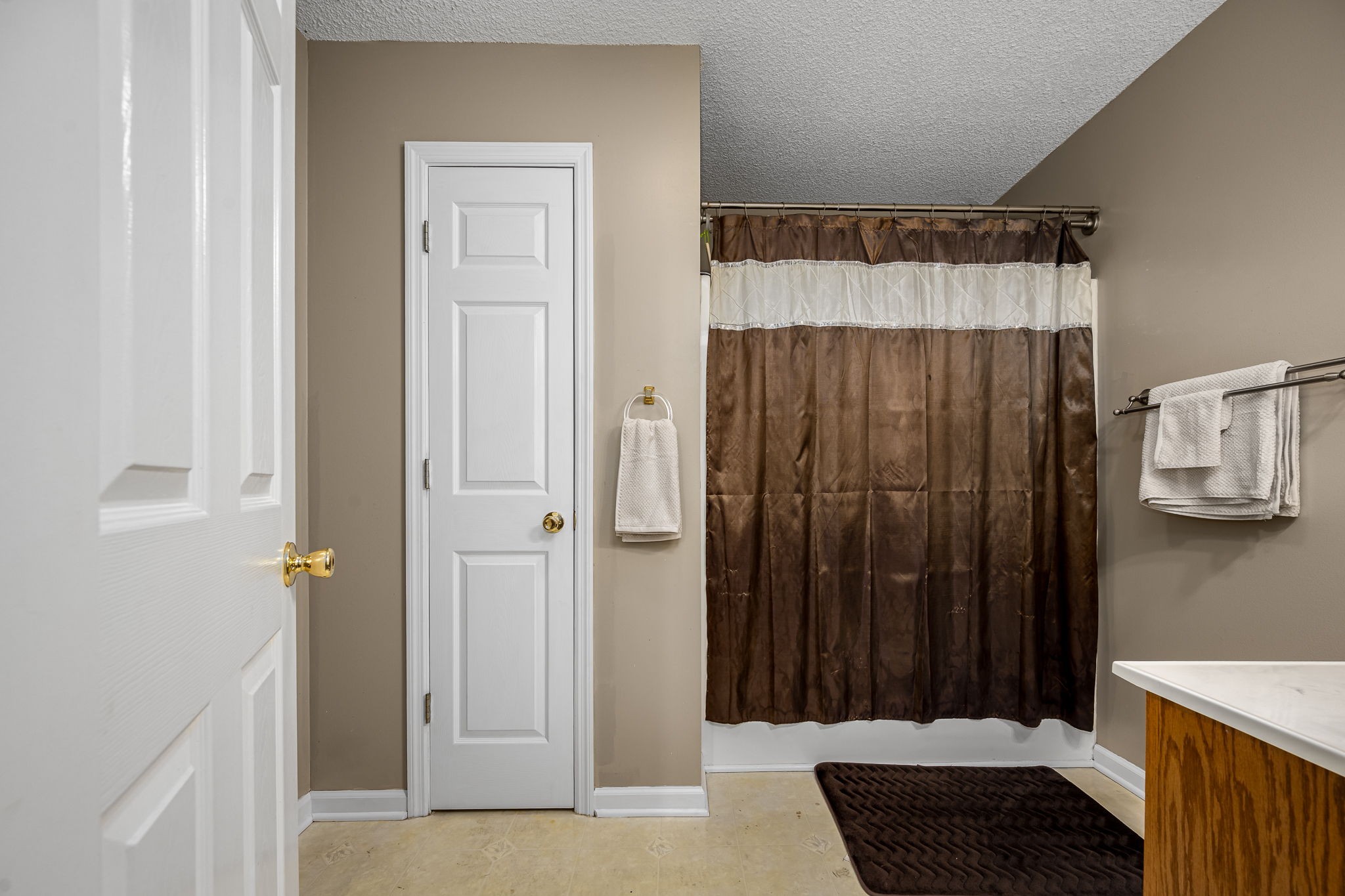 2936 Midland Road Shelbyville, TN 37160 - Photo 28 of 46 a view of a bathroom with a sink and a shower