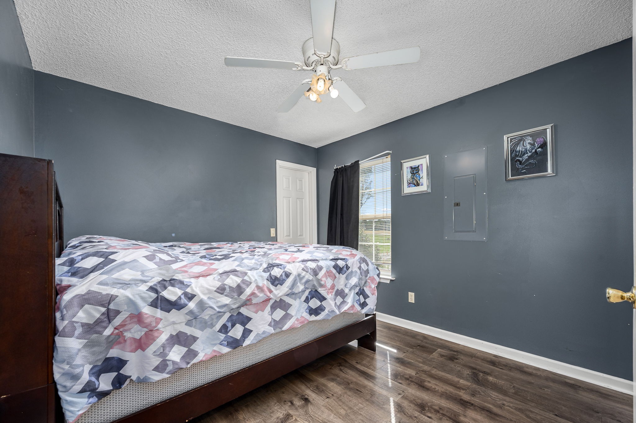 2936 Midland Road Shelbyville, TN 37160 - Photo 29 of 46 a bedroom with a bed and a chandelier