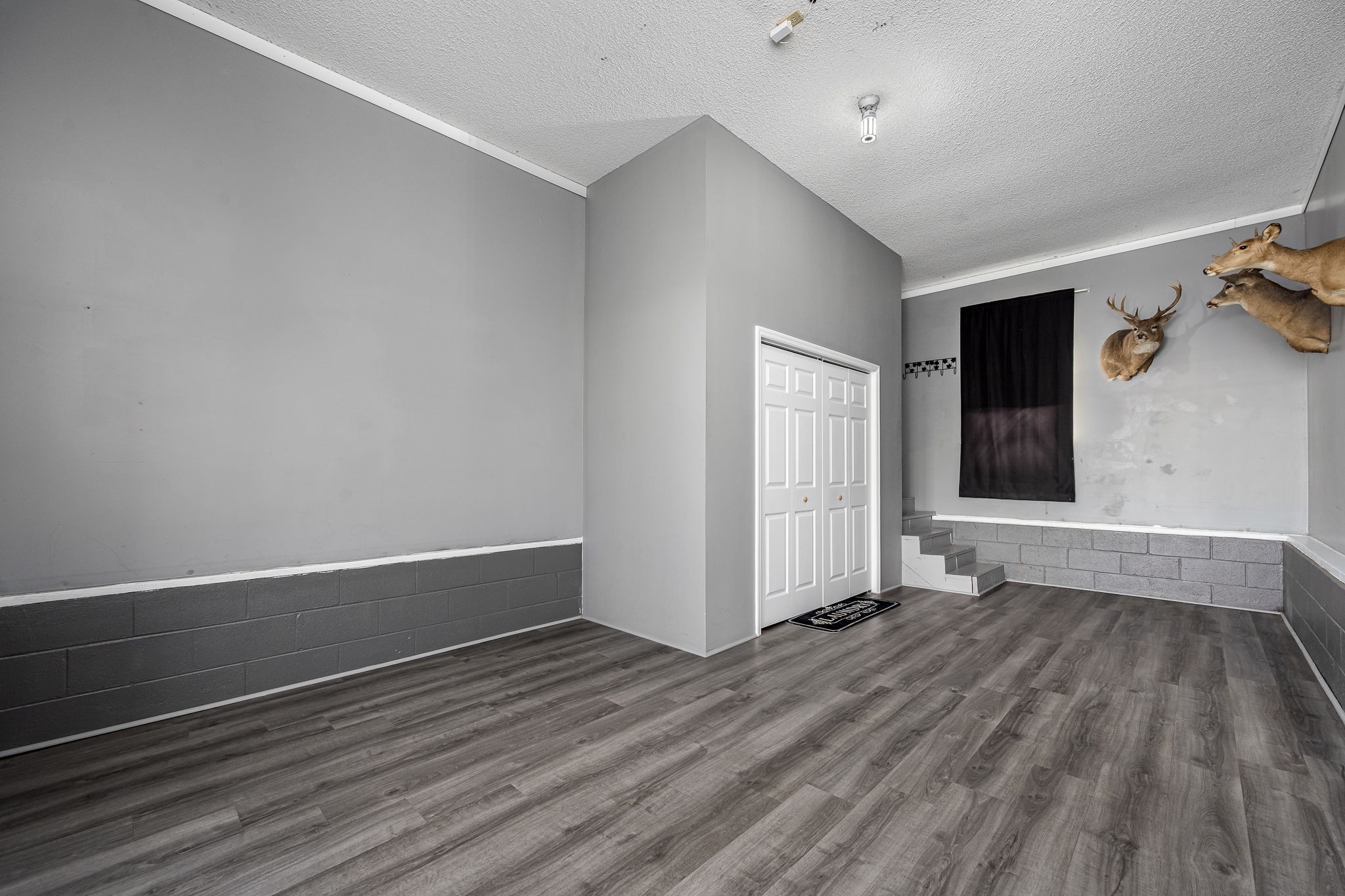 2936 Midland Road Shelbyville, TN 37160 - Photo 32 of 46 an empty room with wooden floor and windows