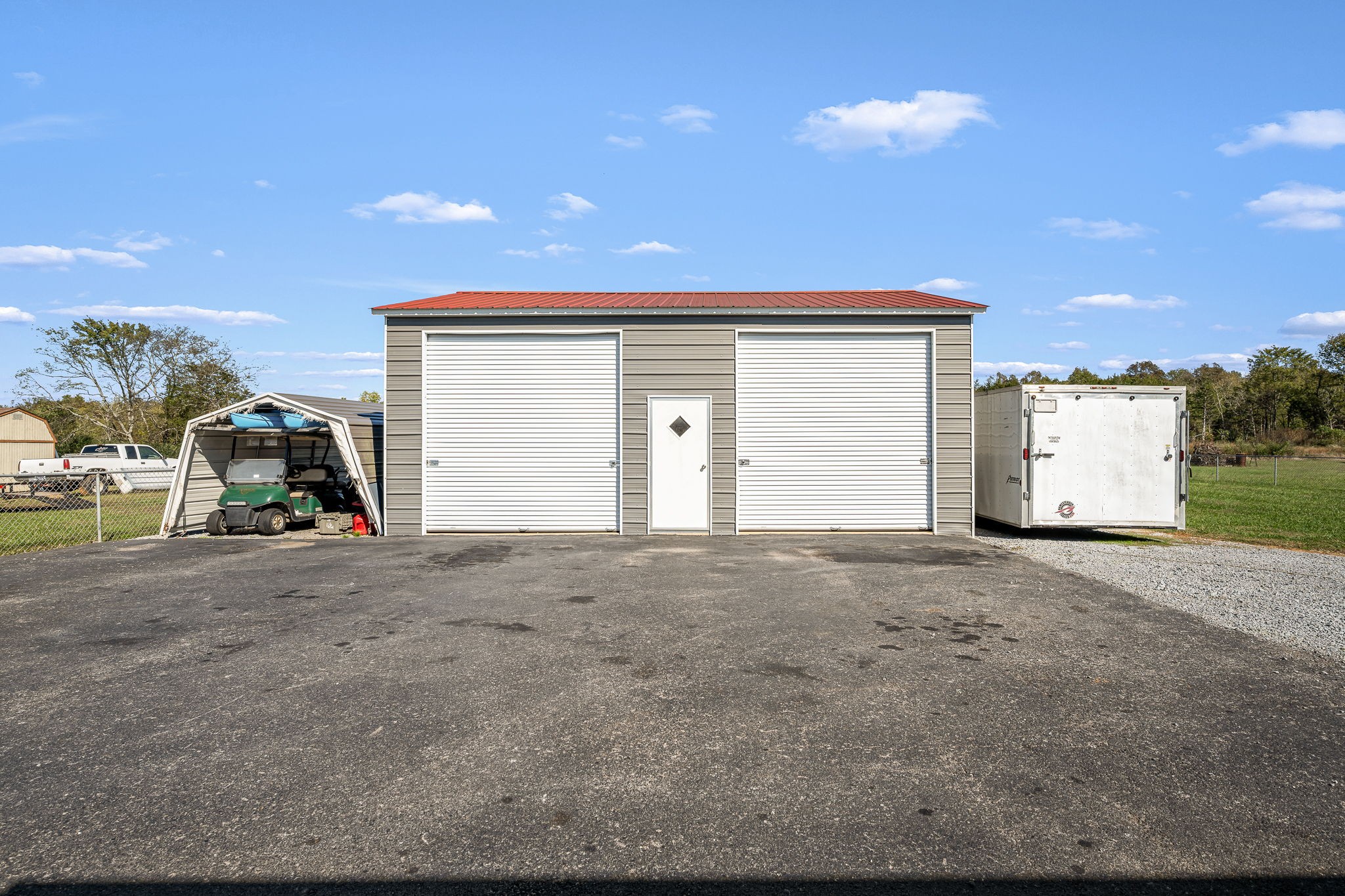 2936 Midland Road Shelbyville, TN 37160 - Photo 39 of 46 a view of a house with a yard and garage