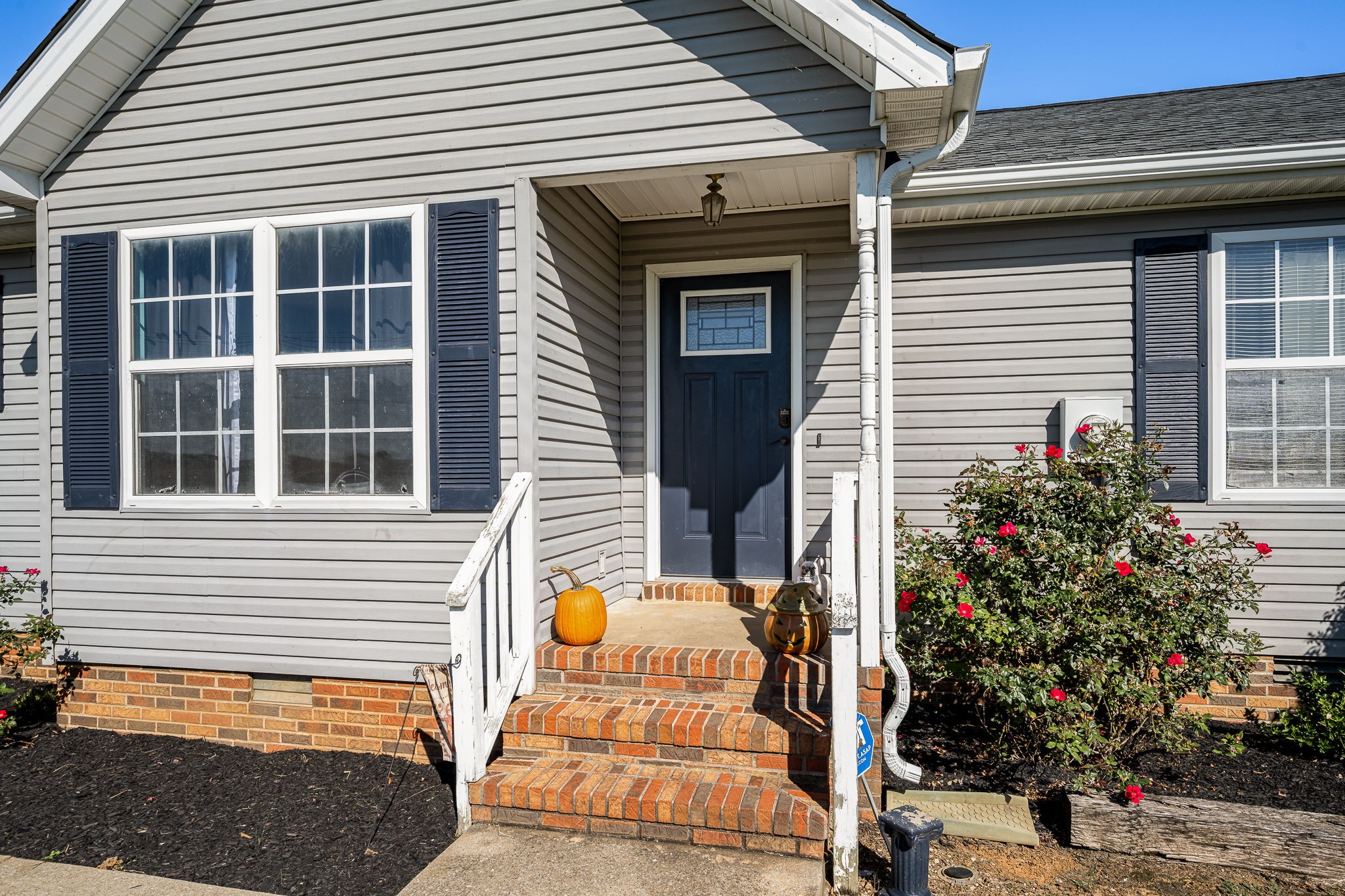 2936 Midland Road Shelbyville, TN 37160 - Photo 8 of 46 a view of a porch with a chairs and potted plants
