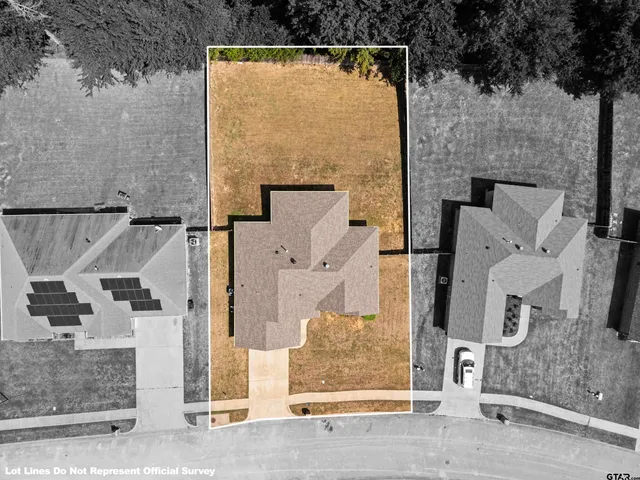 an aerial view of residential house with parking