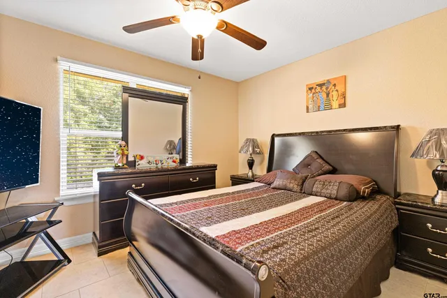 a bed room with bed and a window